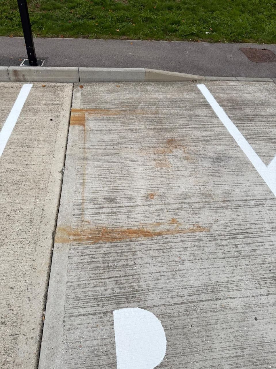 Pressure washing a commercial car park in West Sussex