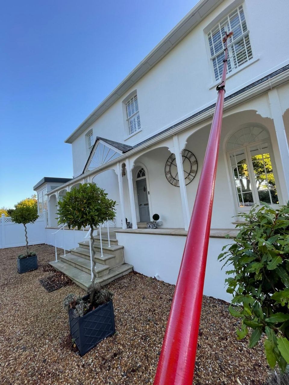 Soft washing the rendered front of a period villa in West Sussex
