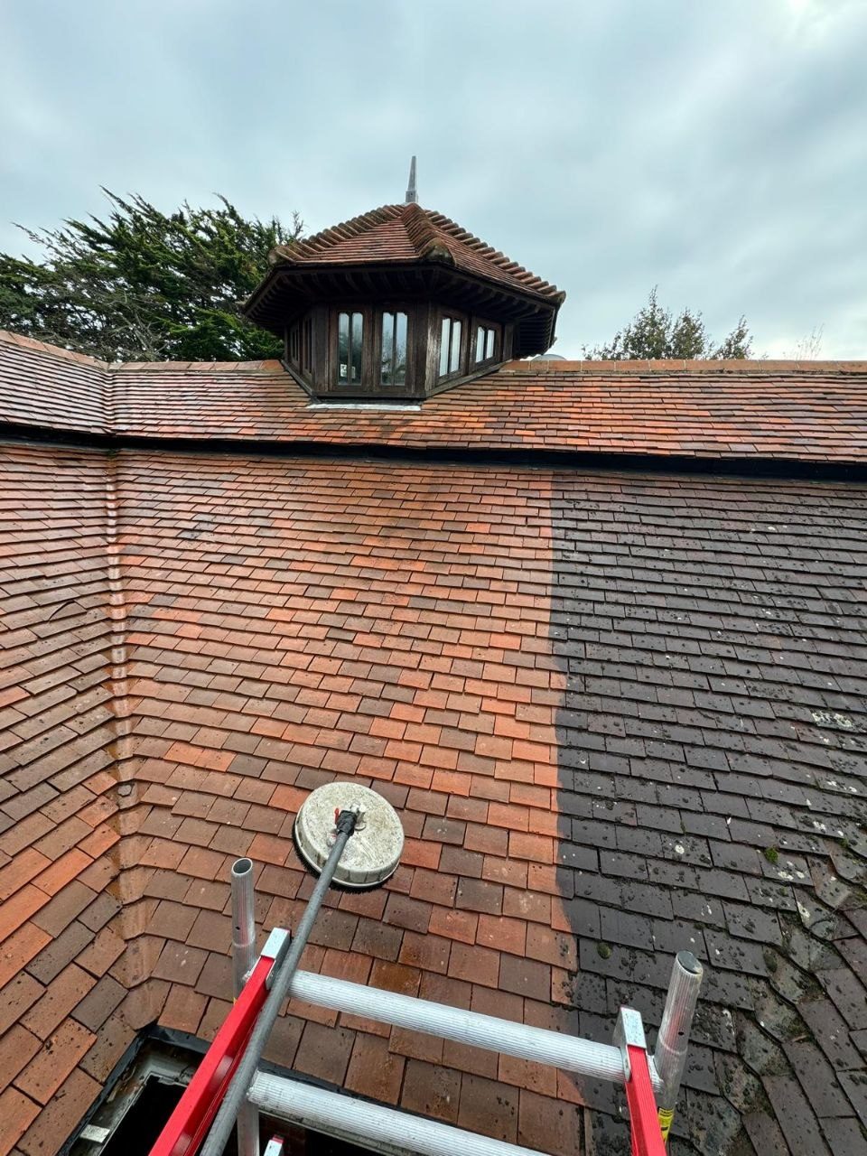 Roof and lantern cleaning on a brick building in West Sussex